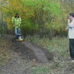 Man compacting mud