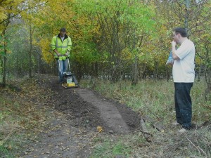 Man compacting mud