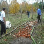 Three men building trail.