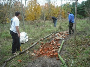 Three men building trail.