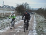 Mountain bikers riding up a hill on the ridgeway.