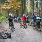 Riders milling about on a track.