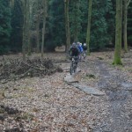 Bike riders on some slabs in the Forest of Dean.