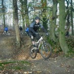 Rider jumping out of bomb hole in Forest of Dean.