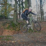 Rider jumping out of bomb hole in Forest of Dean.