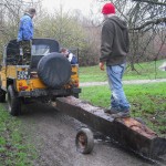 Towing a log with a Land Rover.