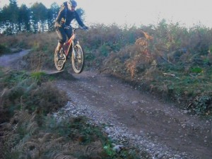 Getting air on the final section of Follow the Dog trail at Cannock Chase.