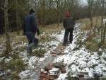 Filling trail with slabs and rubble.