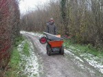 Wheel barrow in muck truck.