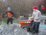 Trail builders filling Muck Truck.