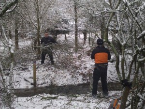 Trail builders in snow.