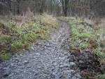 Muddy trail being filled in.