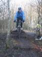 Women riding down log steps.