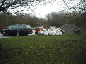 Car, rubble, power barrow, chippings.