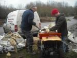 Loading power barrow with concrete slabs.