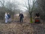 Mountain bike trail builders in some woods.