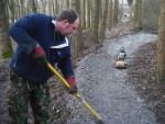 Mountain bike trail builder shaping a berm.