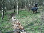 Wheel barrow with drainage pipe.