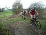 Mountain bike riders on a hill.