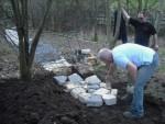 Building a jump on a mountain bike trail.