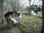 Tipping gravel onto mountain bike trail.