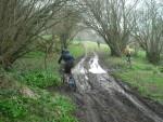 Riding along track with lage puddle.