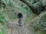 Mountain bike rider on steep track.