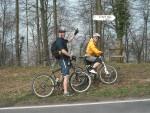 Mountain bikers next to sign saying "steep hill".