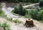 Riders on track below mountain bike trail.