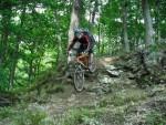 Rider going down some big rocks.