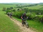 Riders going up steep hill.