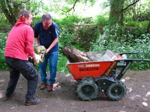 Moving rocks into muck truck.