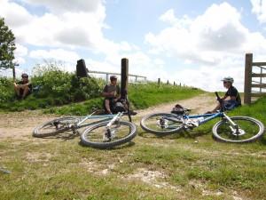Three mountain bikers having a rest.