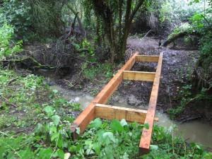Wooden bridge for mountain bike trail.