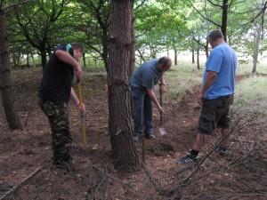 Trail builders at work in August evening.