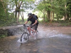 Rider in water splash near Castle Combe.