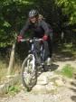 Woman riding down some steps at Croft Trail.