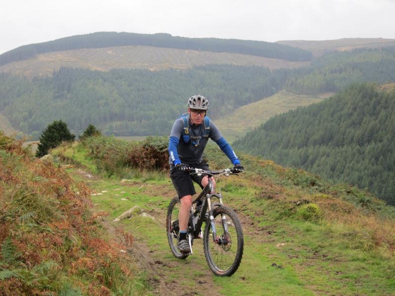 Mountain bikiner on hill in mid wales.