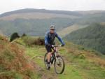 Mountain bikiner on hill in mid wales.