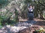 Tipping gravel from wheel barrow.