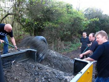 Shifting gravel at a trail build day.