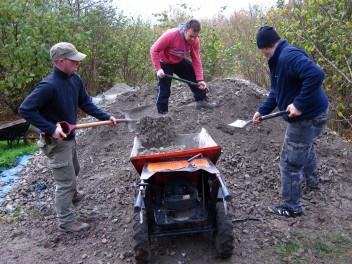 Moving limestone chippings at a trail build day.