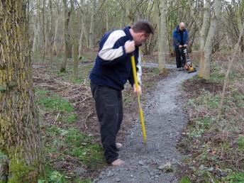 Raking and compacting chippings at the Croft Trail in Swindon.