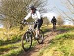 Woman riding down hill near Swindon.