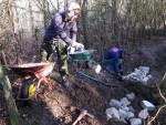 Moving bricks at a trail build day.