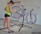 Woman bike mechanic and pink bike.