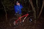 Mountain bike rider in the dark and wet.