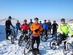 Group of mountain bikers near Barbury Castle in the snow.