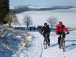 Mountain bikers on snow near Swindon.