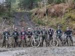 Group of muddy mountain bikers at Brechfa with Mudtrek